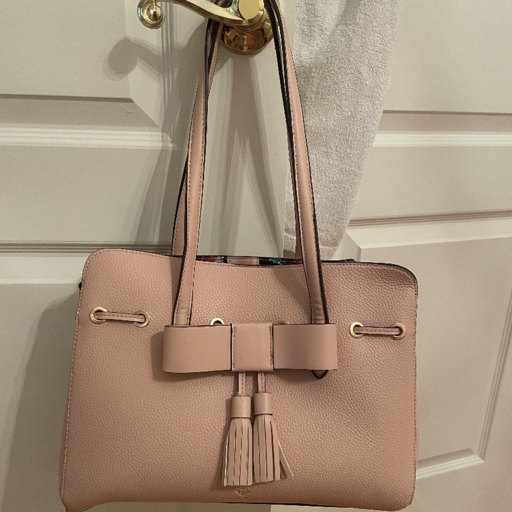 Brand new handbag ticket still on